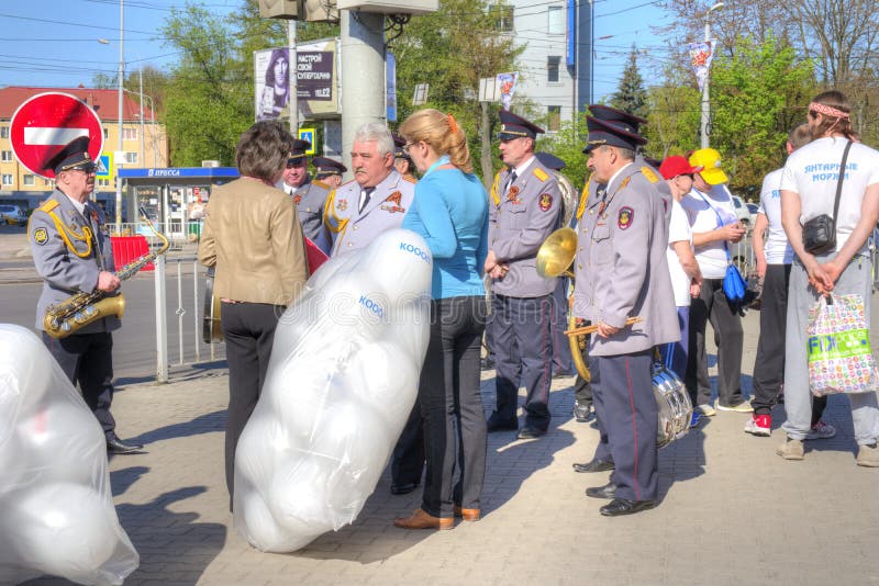 KALININGRAD, RUSSIA - May 01.2018: Residents of the city are waiting for the start of the May Day demonstration in the city center. KALININGRAD, RUSSIA - May 01.2018: Residents of the city are waiting for the start of the May Day demonstration in the city center