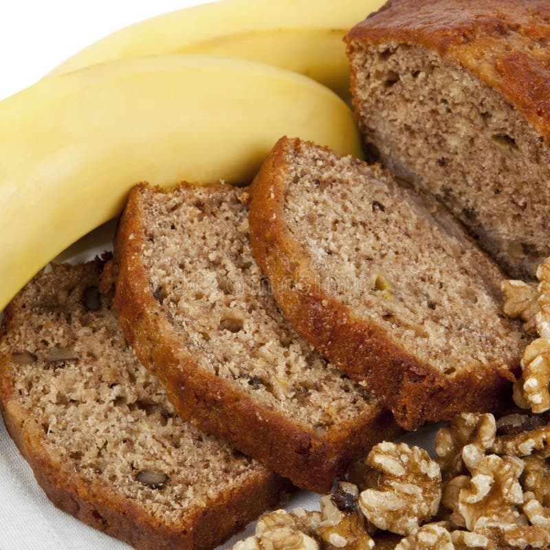 Fresh banana and walnut bread loaf, sliced. Delicious healthy eating. Fresh banana and walnut bread loaf, sliced. Delicious healthy eating.