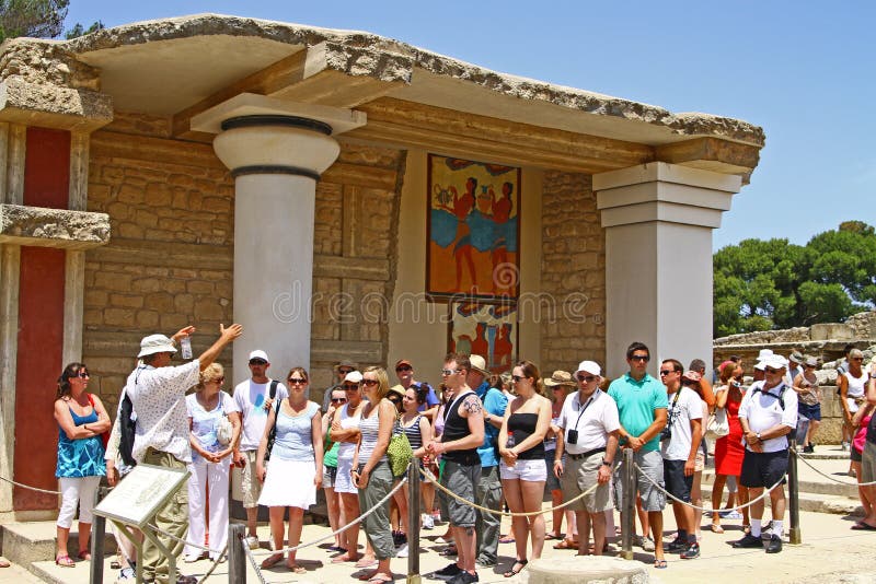 A Group of people getting a guided tour of the ruins of the knossos temple in crete greece. A Group of people getting a guided tour of the ruins of the knossos temple in crete greece.