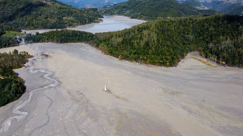 Aerial View Over a Big Waste Lake Polluted With Toxic Mining Residuals Tailings From an Open Pit Copper Mine in Geamana, Rosia Poieni, Romania. Aerial View Over a Big Waste Lake Polluted With Toxic Mining Residuals Tailings From an Open Pit Copper Mine in Geamana, Rosia Poieni, Romania