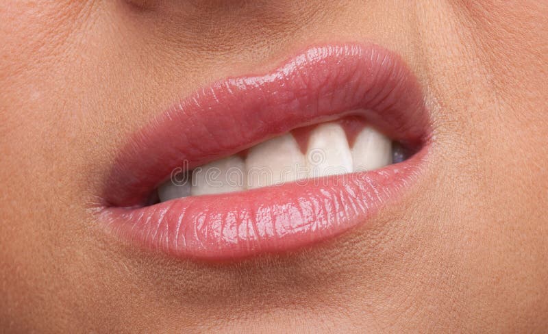 Beauty woman lips anger emotions close-up shot. Beauty woman lips anger emotions close-up shot