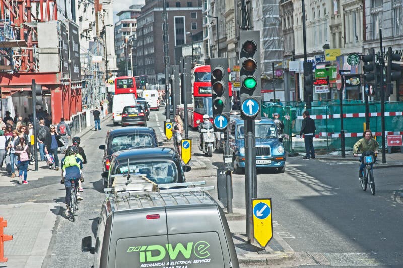 Traffic in Oxford Street London comprising vans, taxis, buses and cyclists nose to tail with construction sites to right and left. Traffic in Oxford Street London comprising vans, taxis, buses and cyclists nose to tail with construction sites to right and left.