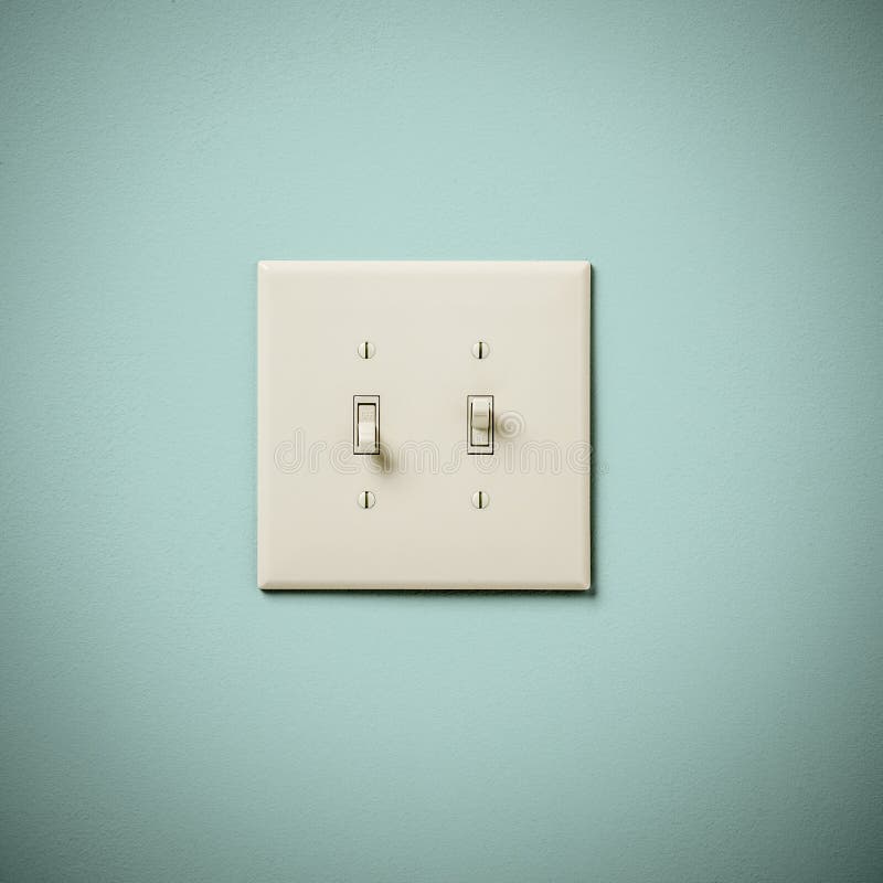 Двойное Lightswitch на стене Teal Aqua голубого зеленого цвета время от времени стоковое изображение
