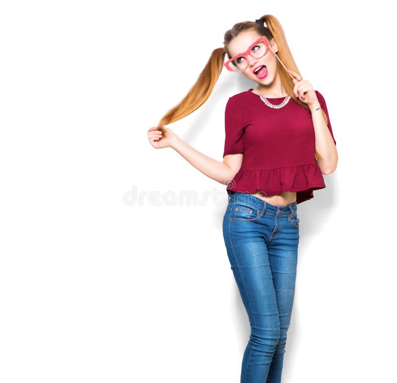 Surprised teenage girl holding funny paper glasses on stick. Surprised teenage girl holding funny paper glasses on stick