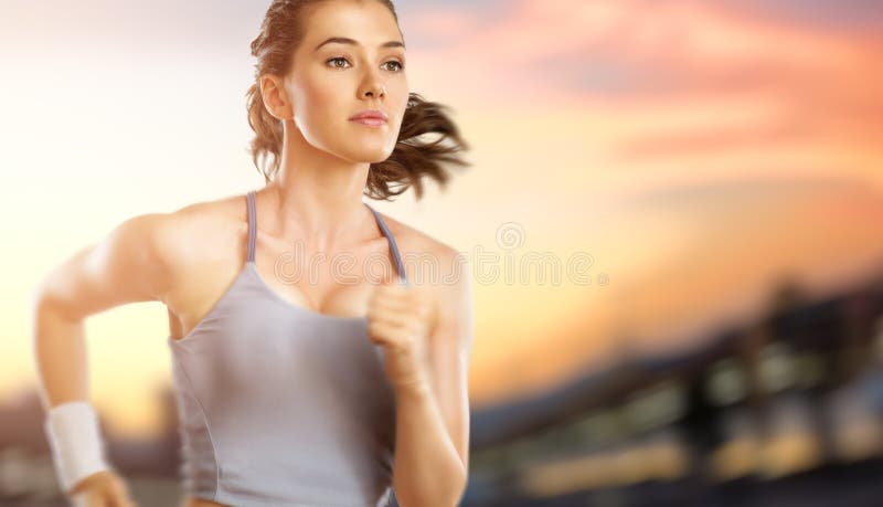 Girl in sport on the sunset background. Girl in sport on the sunset background