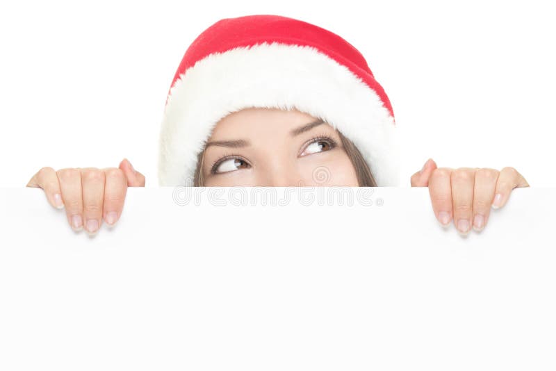 девушка доски над peeking знак santa стоковая фотография девушка доски над peeking знак santa стоковая фотография