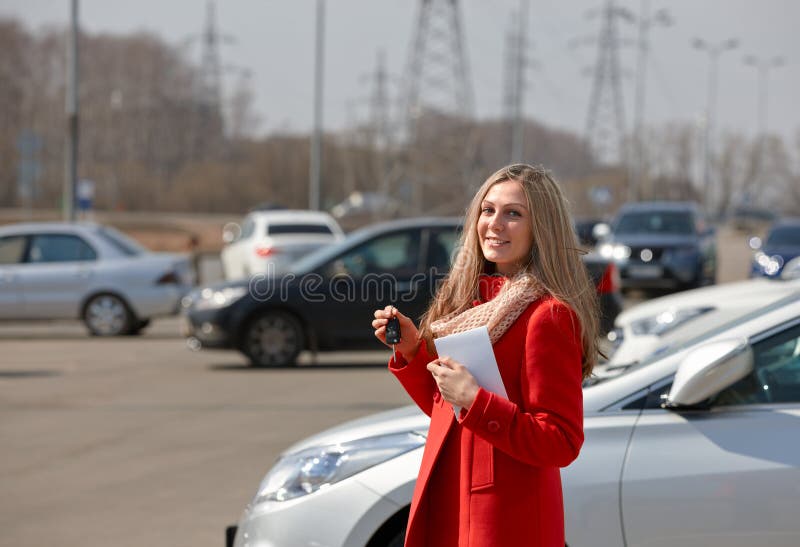 Happy beautiful woman with keys from car. Happy beautiful woman with keys from car