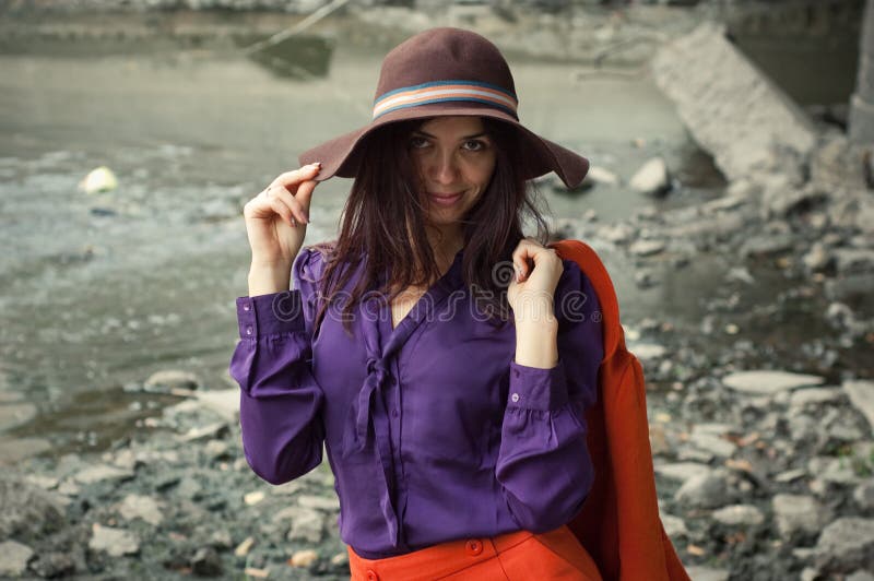 Fashion girl standing under a bridge. Fashion girl standing under a bridge