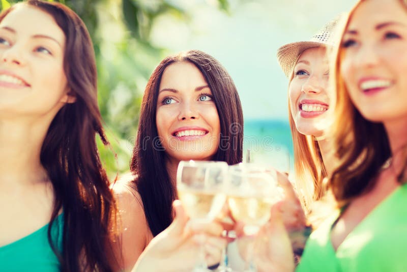Summer holidays, vacation and celebration - girls with champagne glasses. Summer holidays, vacation and celebration - girls with champagne glasses.