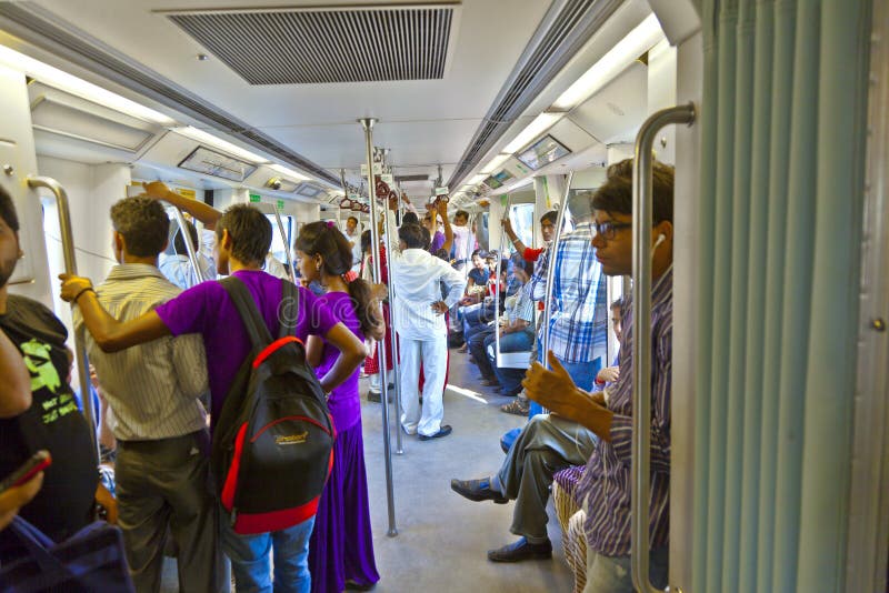 DELHI - NOVEMBER 11: passengers alighting metro train on November 11, 2011 in Delhi, India. Nearly 1 million passengers use the metro daily. DELHI - NOVEMBER 11: passengers alighting metro train on November 11, 2011 in Delhi, India. Nearly 1 million passengers use the metro daily.