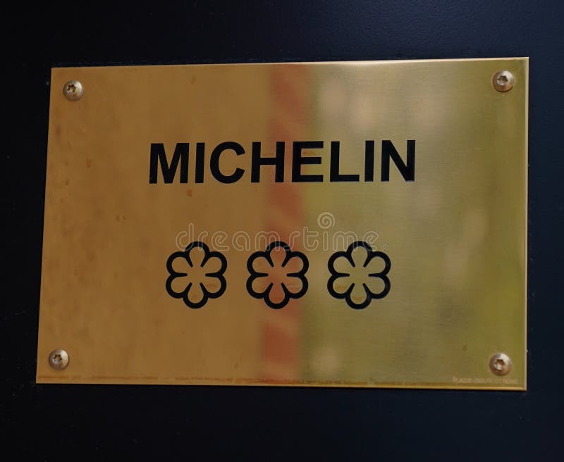 TINQUEUX, FRANCE - MAY 27, 2022: Three Star Michelin Guide plaque at the Three Star Michelin L`Assiette Champenoise restaurant  run by famous Chef Arnaud Lallement in a family run hotel in a suburb of Reims, France. TINQUEUX, FRANCE - MAY 27, 2022: Three Star Michelin Guide plaque at the Three Star Michelin L`Assiette Champenoise restaurant  run by famous Chef Arnaud Lallement in a family run hotel in a suburb of Reims, France