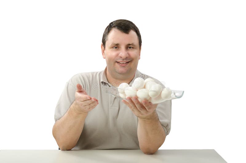 Happy farmer holding a glass basket of white chicken eggs in left hand. Happy farmer holding a glass basket of white chicken eggs in left hand