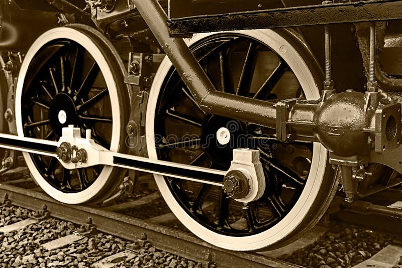 Деталь и конец Sepia вверх огромных колес на одном старом locomo пара стоковая фотография rf Деталь и конец Sepia вверх огромных колес на одном старом locomo пара стоковая фотография rf