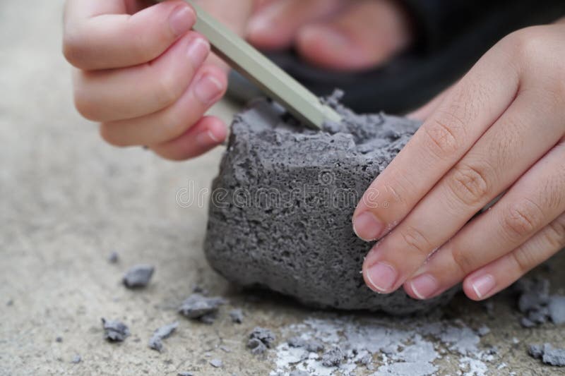 The kids enjoyed the archaeological dig at home during the early childhood holidays,oy plays an archaeologist excavated, training for dig fossil. The kids enjoyed the archaeological dig at home during the early childhood holidays,oy plays an archaeologist excavated, training for dig fossil