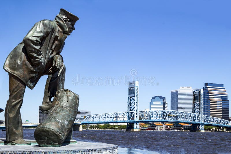 Jacksonville, Florida skyline and sailor sculpture along the St Johns River. Jacksonville, Florida skyline and sailor sculpture along the St Johns River