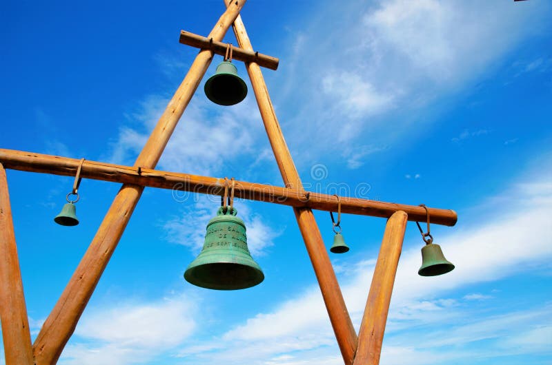 Low angle view of a wooden construction with bells in front of the house of Pablo Neruda. Low angle view of a wooden construction with bells in front of the house of Pablo Neruda