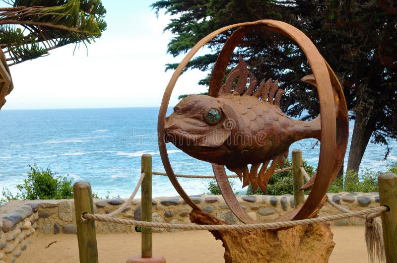 View onto the ocean outside of Pablo Nerudas house with a statue of a fish in the foreground. View onto the ocean outside of Pablo Nerudas house with a statue of a fish in the foreground