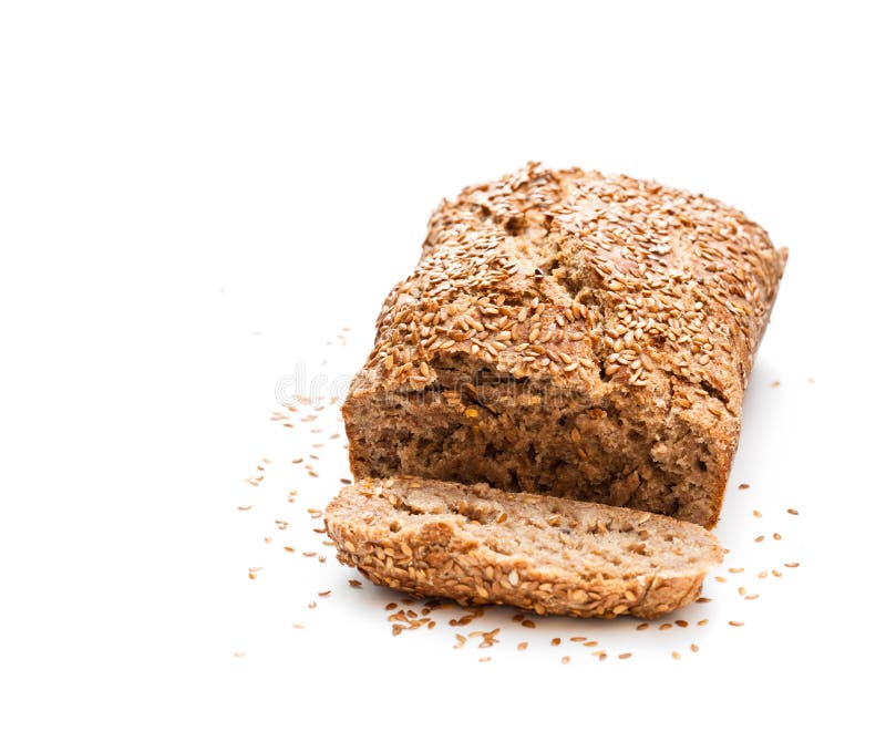 Домодельный хлеб рож wholemeal при семена льна изолированные на белизне стоковое фото rf Домодельный хлеб рож wholemeal при семена льна изолированные на белизне стоковое фото rf