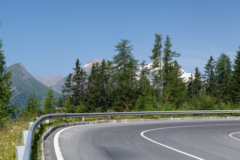 Winding mountain road with crash barrier. Winding mountain road with crash barrier