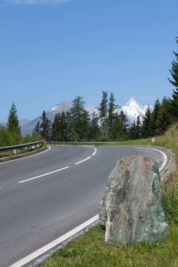 Winding mountain road with crash barrier. Winding mountain road with crash barrier