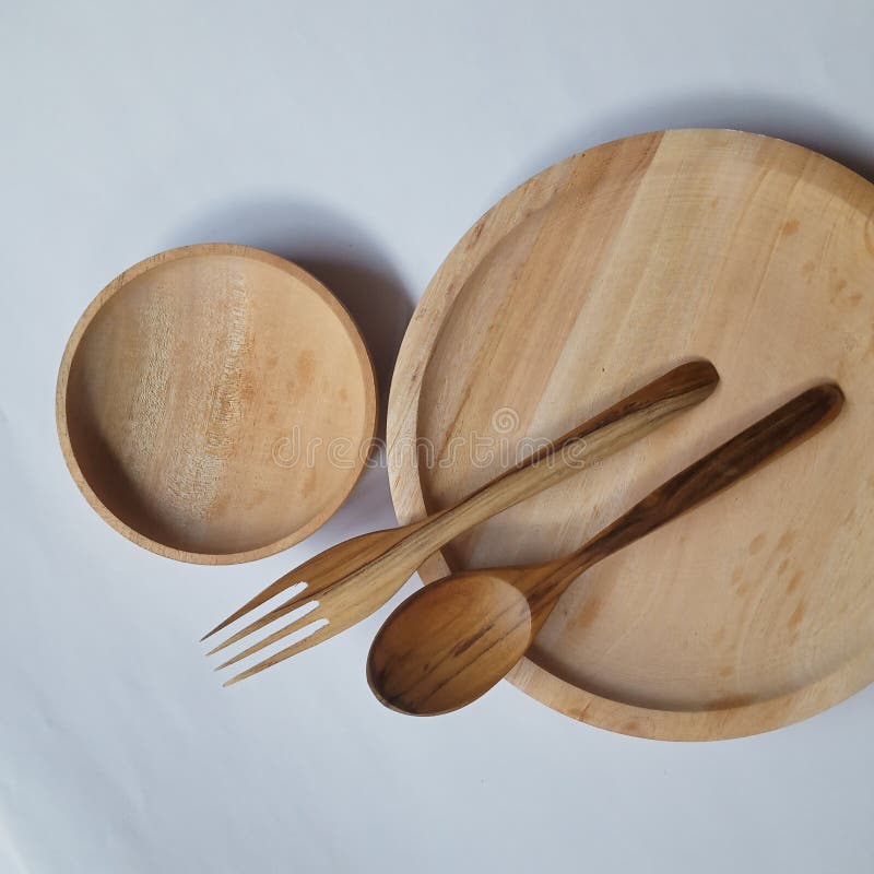 tableware made of wood in the form of plates, spoons, and forks that can be used every day. tableware made of wood in the form of plates, spoons, and forks that can be used every day