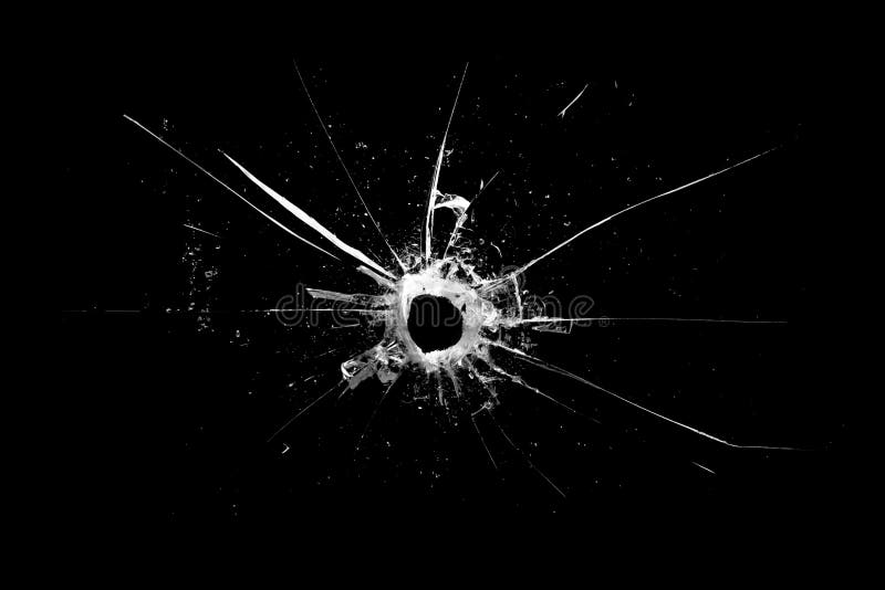 hole in the glass with cracks isolated on a black. hole in the glass with cracks isolated on a black