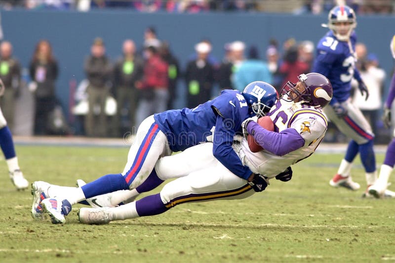 Cornerback Dave Thomas of the New York Giants makes the hit on the Minnesota Vikings player at the NFC Championship game. Cornerback Dave Thomas of the New York Giants makes the hit on the Minnesota Vikings player at the NFC Championship game.