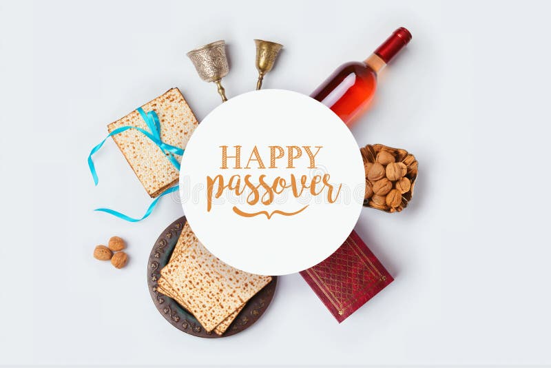 Jewish holiday Passover banner design with wine, matza and seder plate on white background. View from above. Flat lay. Jewish holiday Passover banner design with wine, matza and seder plate on white background. View from above. Flat lay