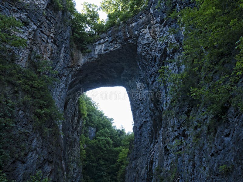 Natural Bridge in Rockbridge County, Virginia, is a geological formation in which Cedar Creek a small tributary of the James River has carved out a gorge in the mountainous limestone terrain, forming a natural arch 215 ft. Natural Bridge in Rockbridge County, Virginia, is a geological formation in which Cedar Creek a small tributary of the James River has carved out a gorge in the mountainous limestone terrain, forming a natural arch 215 ft