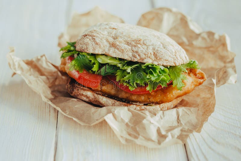 Fried Fish Sandwich with Lettuce, Tomato with Tartar Sauce. Author`s