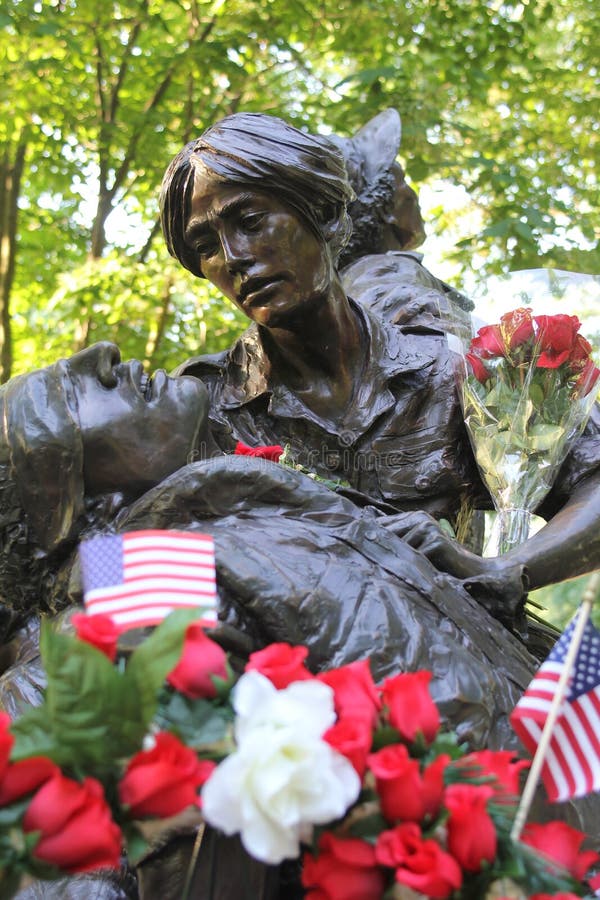 Dedicated to U.S. women who served in the Vietnam War,the Vietnam Women's Memorial in Washington,DC,depicts two nurses aiding a wounded U.S. soldier. The bronze statue,created by sculptor Glenna Goodacre,was unveiled on Veterans Day 1993. Dedicated to U.S. women who served in the Vietnam War,the Vietnam Women's Memorial in Washington,DC,depicts two nurses aiding a wounded U.S. soldier. The bronze statue,created by sculptor Glenna Goodacre,was unveiled on Veterans Day 1993.