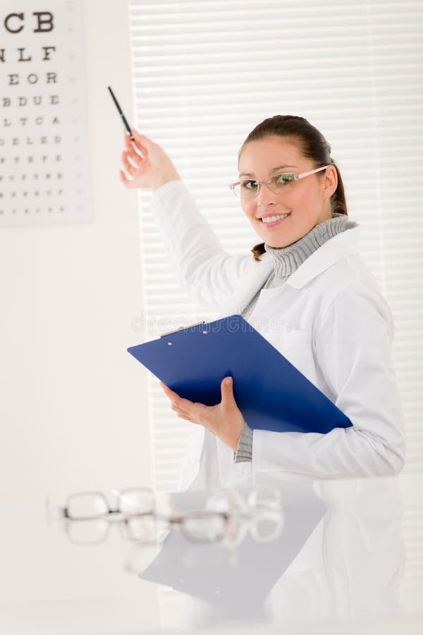 Optician doctor woman with prescription glasses and eye chart. Optician doctor woman with prescription glasses and eye chart