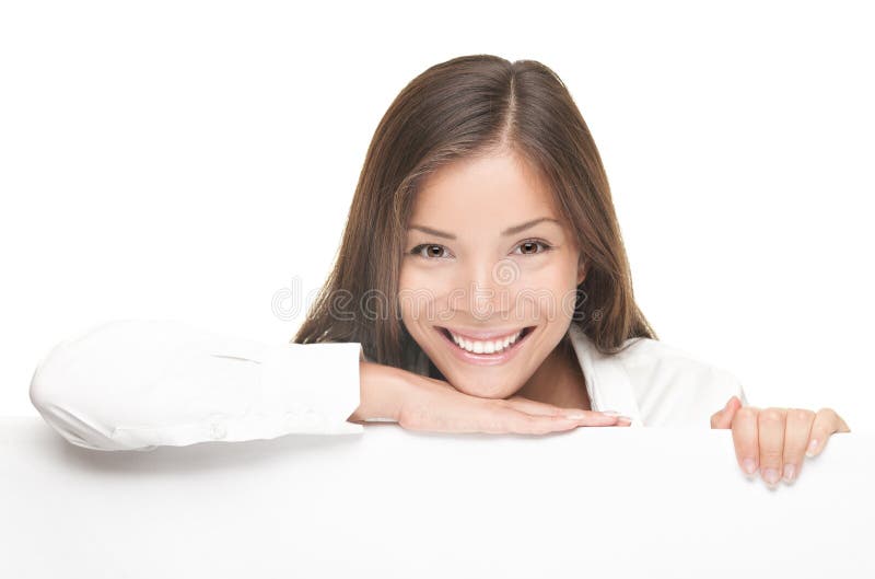 Woman billboard sign. Young beautiful woman smiling showing blank white placard. Casual and relaxed pose by young Asian / Caucasian female model with friendly smile. Isolated on white background. Woman billboard sign. Young beautiful woman smiling showing blank white placard. Casual and relaxed pose by young Asian / Caucasian female model with friendly smile. Isolated on white background