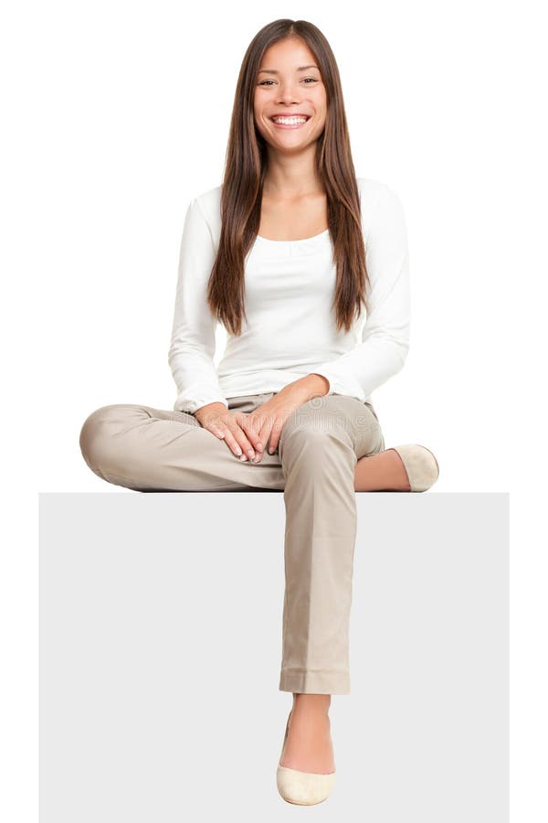 Sign people. Woman sitting on blank billboard placard sign. Casual young beautiful multiracial Asian isolated on white background. Sign people. Woman sitting on blank billboard placard sign. Casual young beautiful multiracial Asian isolated on white background.