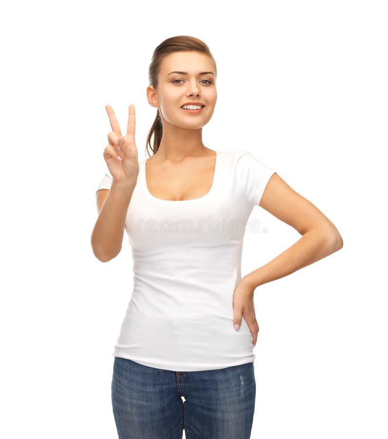 Young smiling woman showing victory or peace sign. Young smiling woman showing victory or peace sign