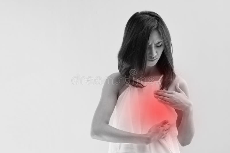 Breast Cancer woman examines her breast with red alert accent. Breast Cancer woman examines her breast with red alert accent