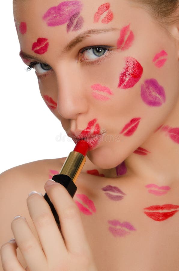 Woman with kisses on face in lipstick and lips isolated on white. Woman with kisses on face in lipstick and lips isolated on white