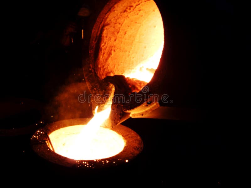 Liquid iron from the ladle in the casting iron process. Liquid iron from the ladle in the casting iron process