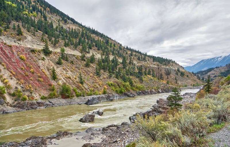 Scenic view of the Fraser River valley in autumn. murky waters of the river flows in a picturesque desert canyon. BC Canada. Scenic view of the Fraser River valley in autumn. murky waters of the river flows in a picturesque desert canyon. BC Canada