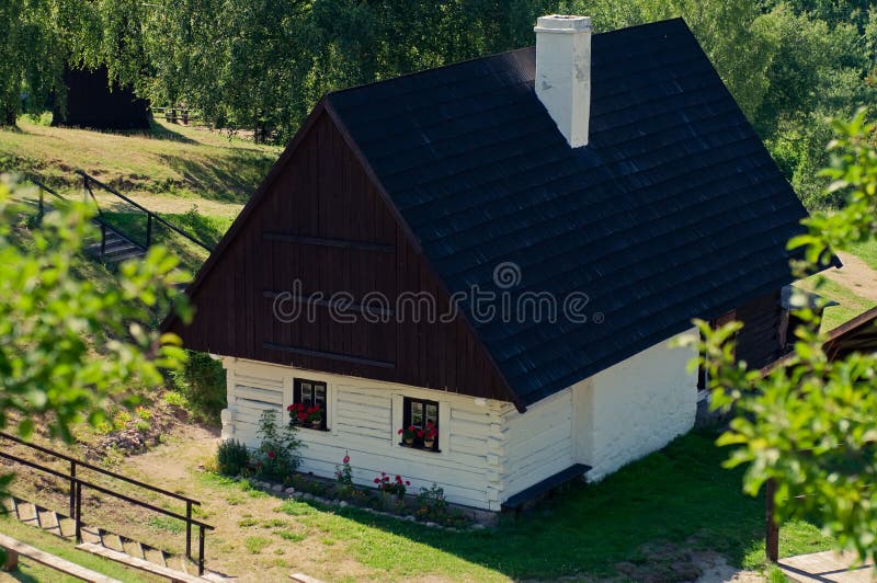 Beautiful historic log house during the sunny day. Beautiful historic log house during the sunny day.