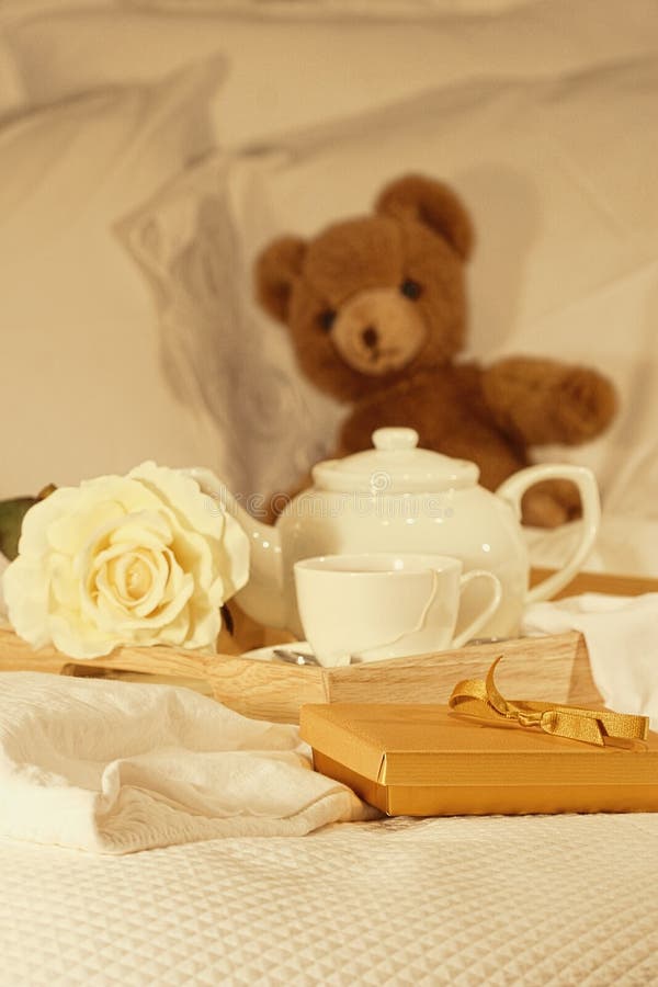 Morning breakfast in bed with tea and gift. Morning breakfast in bed with tea and gift