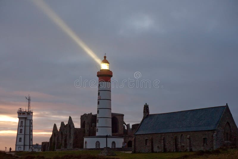 St Mathieu lighthouse illuminated and old abbey ruins, brittany, france. St Mathieu lighthouse illuminated and old abbey ruins, brittany, france