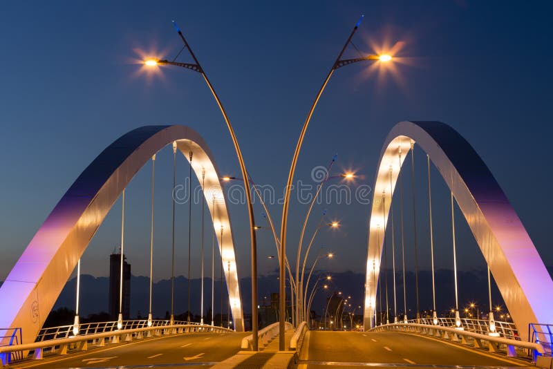 The new Basarab Overpass Bridge, one of the largest suspension bridges in Europe, illuminated at twilight in Bucharest, Romania. The new Basarab Overpass Bridge, one of the largest suspension bridges in Europe, illuminated at twilight in Bucharest, Romania.