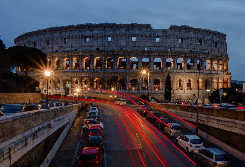 Illuminated Colosseum in Rome at night. Ruins of the ancient Roman amphitheatre. Travel to Italy, Europe. Illuminated Colosseum in Rome at night. Ruins of the ancient Roman amphitheatre. Travel to Italy, Europe.