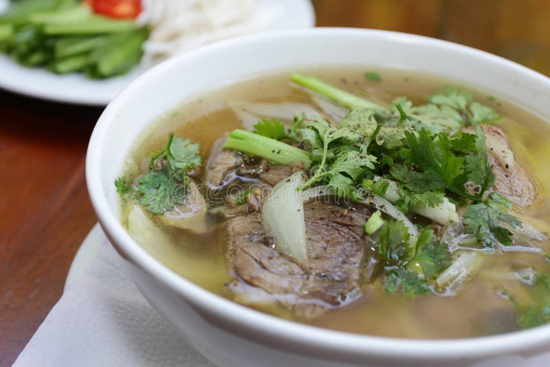 Close up of a bowl of Chinese style on wooden background ,Beef Noodle Soup. Close up of a bowl of Chinese style on wooden background ,Beef Noodle Soup.