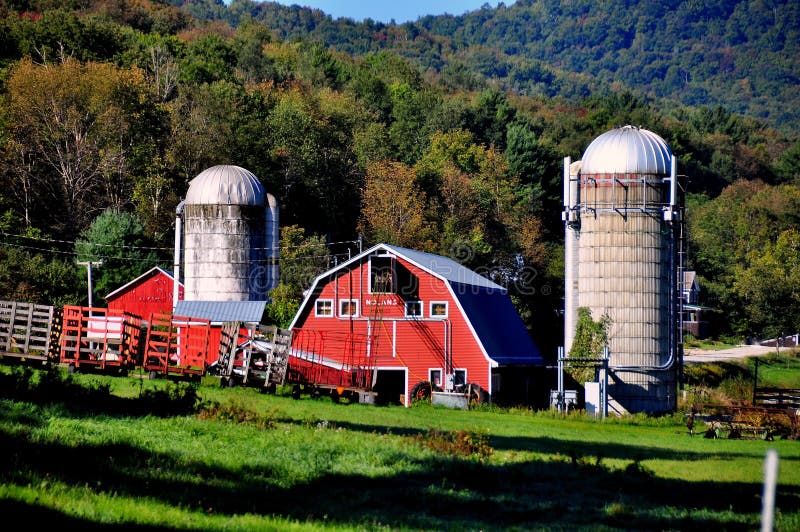 West Arlington, Vermont: The Nolan Farm with its red barn and two large silos set against verdant fields and forested hills *. West Arlington, Vermont: The Nolan Farm with its red barn and two large silos set against verdant fields and forested hills *