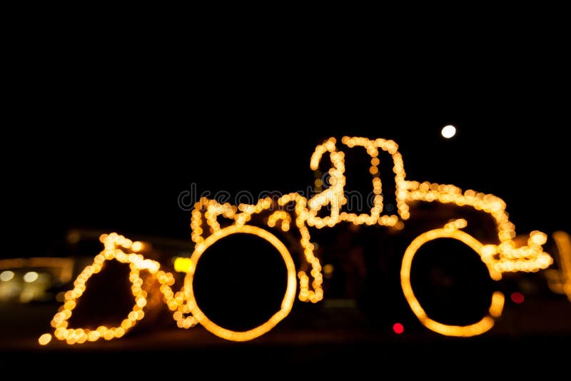 Запачканный затяжелитель колеса украшенный с светами/bokeh освещает на whe стоковые изображения rf Запачканный затяжелитель колеса украшенный с светами/bokeh освещает на whe стоковые изображения rf