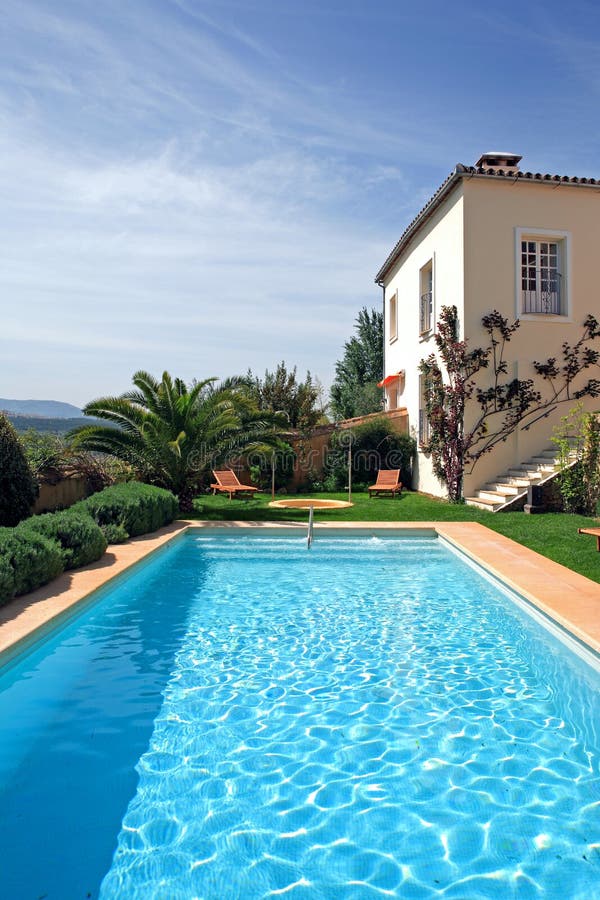 Large rustic hotel and swimming pool set in beautiful gardens in the Spanish countryside. Large rustic hotel and swimming pool set in beautiful gardens in the Spanish countryside