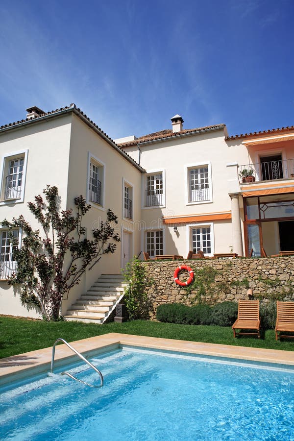 Large rustic hotel and swimming pool set in beautiful gardens in the Spanish countryside. Large rustic hotel and swimming pool set in beautiful gardens in the Spanish countryside