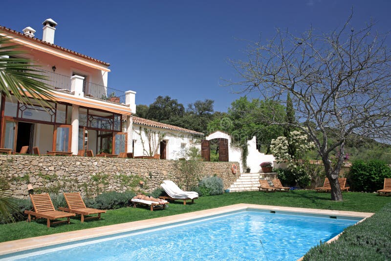 Large rustic hotel and swimming pool set in beautiful gardens in the Spanish countryside. Large rustic hotel and swimming pool set in beautiful gardens in the Spanish countryside